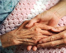 Caregiver hands with patient