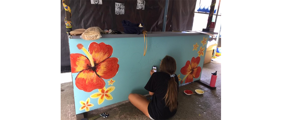 Sandy Taradash's granddaughter Shayna decorates a Homecoming float