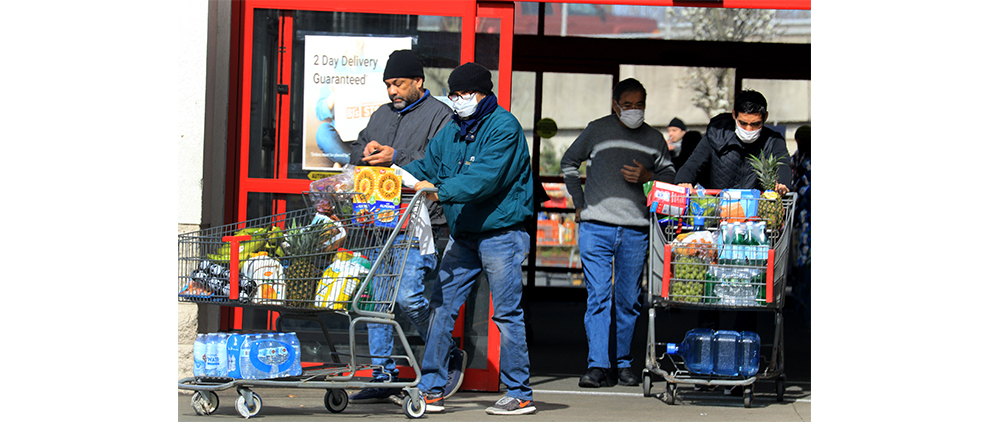 PARAMUS, NJ 03-21-2020 CORONAVIRUS OUTBREAK: Shoppers stock up on food and supplies at the BJ’s warehouse club in Paramus on Saturday. The coronavirus outbreak has caused many to purchase an extra supplies. Many wore masks and gloves and practiced social distancing. -photo by Thomas E. Franklin